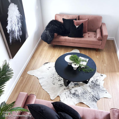 Sollia 3-Seater Velvet Sofa - Blush, featuring soft velvet upholstery, elegant bolster pillows, and sleek wooden feet, set in a cozy living room with a coffee table and decorative pillows.