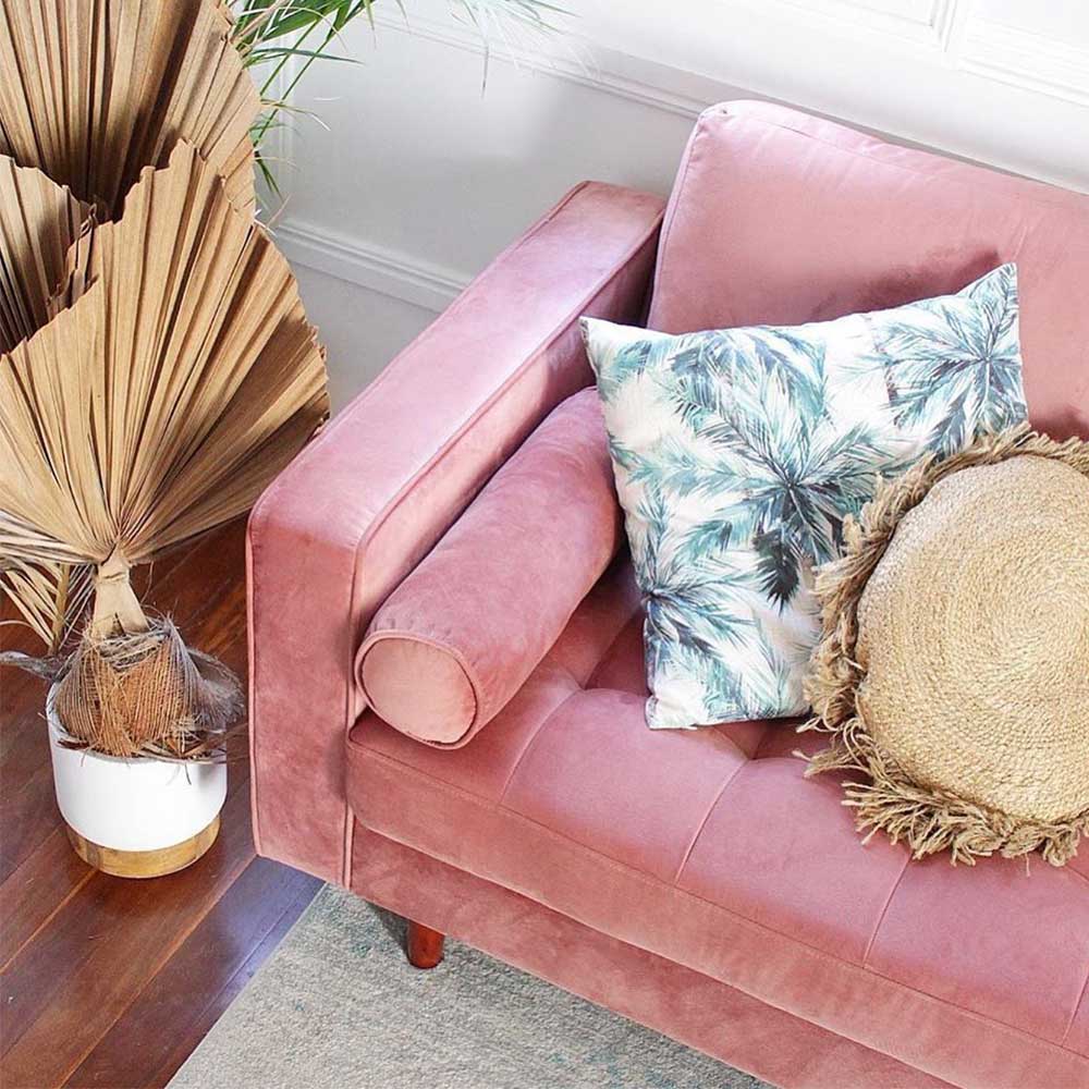 Sollia 3-Seater Velvet Sofa - Blush featuring plush velvet upholstery, matching bolster pillows, and sleek wooden feet, offering a sophisticated, modern look with ample seating for three.