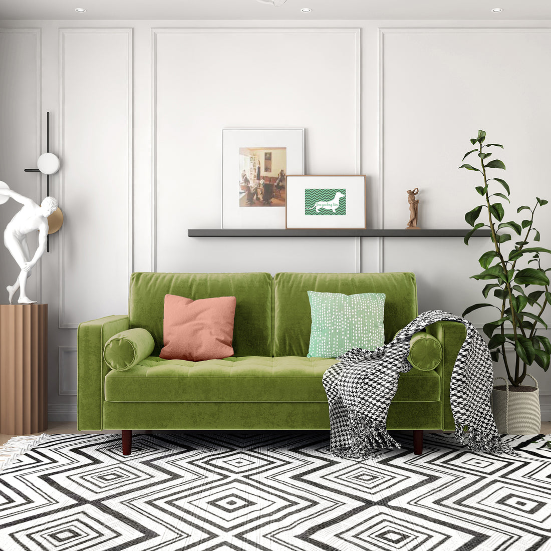 Sollia 3-Seater Velvet Sofa in jade green with plush velvet upholstery, matching round bolster pillows, and stylish wooden feet, set on a green couch with a pink pillow and decorative statue nearby.