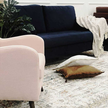 Sollia 3-Seater Velvet Sofa in Navy Blue, featuring plush velvet upholstery and two matching bolster pillows, set on a sturdy wooden frame with elegant finishing suitable for modern interiors.