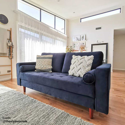 Sollia 3-Seater Velvet Sofa in Navy Blue, showcasing plush velvet upholstery with sleek lines, complemented by matching bolster pillows on a couch, enhancing any modern interior space with elegance.