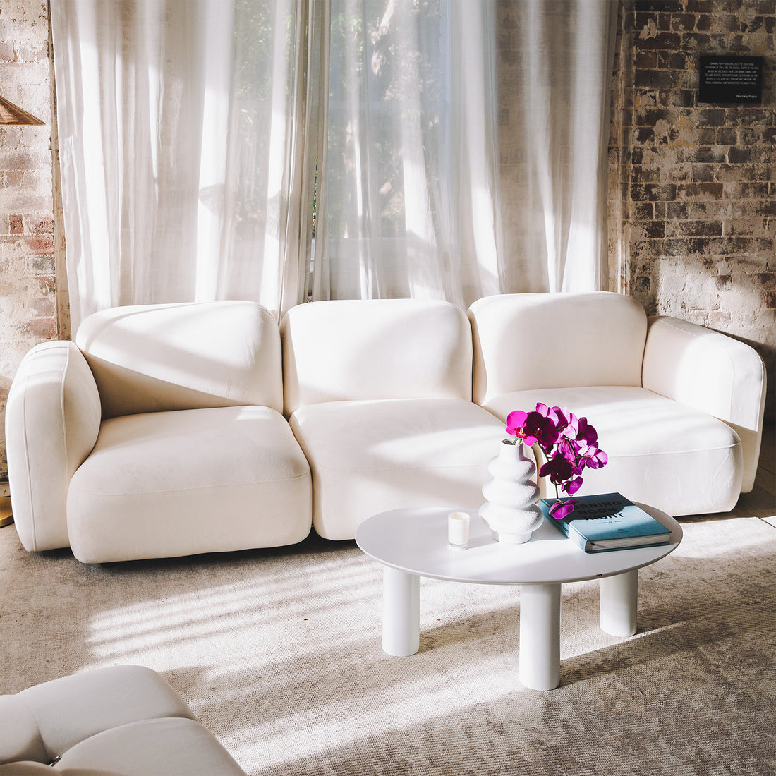 Soraya 3 Seater Modular Velvet Sofa Set in Cream White showcased in a modern interior, featuring plush velvet upholstery with modular design, enhancing a luxurious, inviting living space.