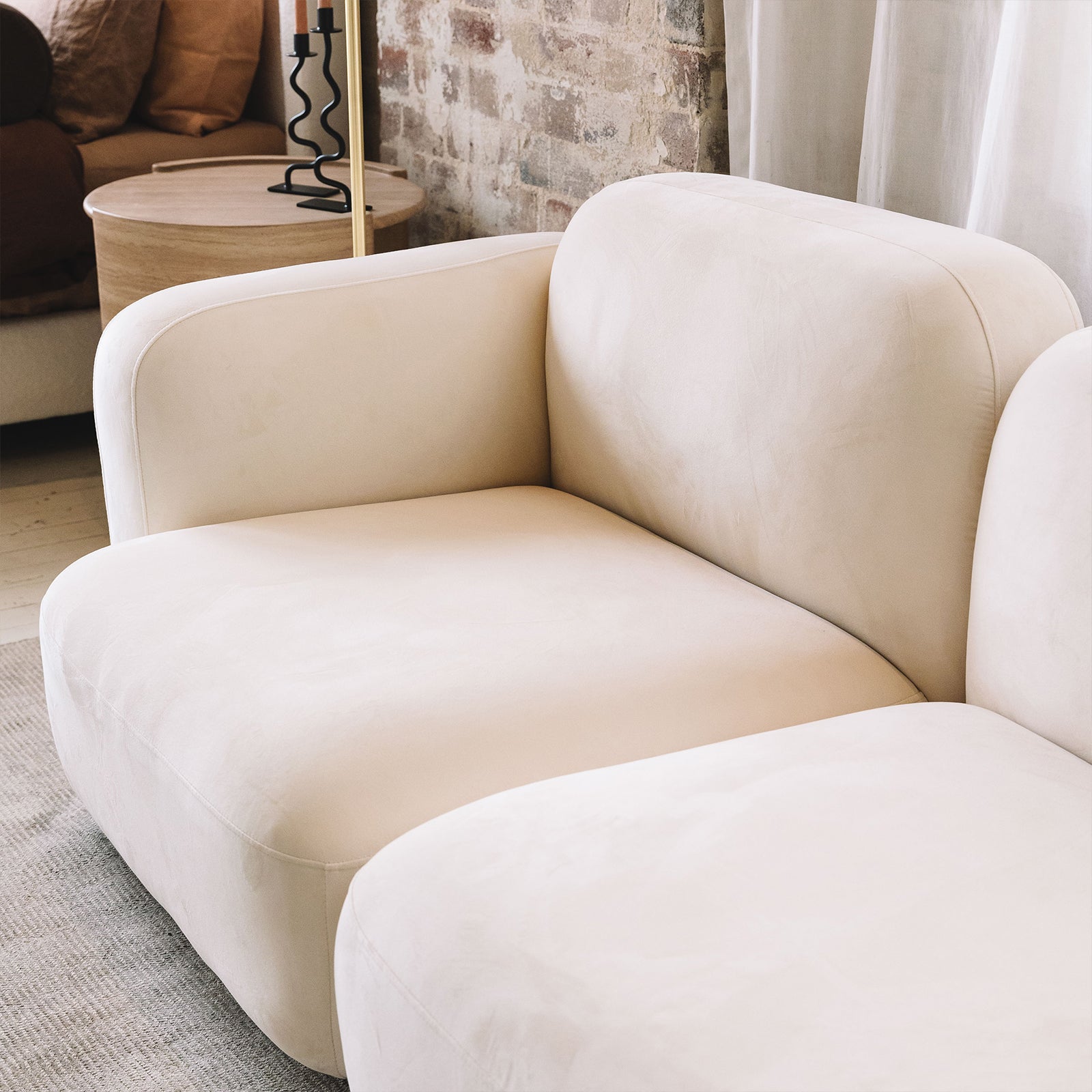 Close-up of the Soraya 3 Seater Modular Velvet Sofa Set, showcasing its plush cushions and armrest with luxurious velvet texture, highlighting its elegant design and comfortable seating.
