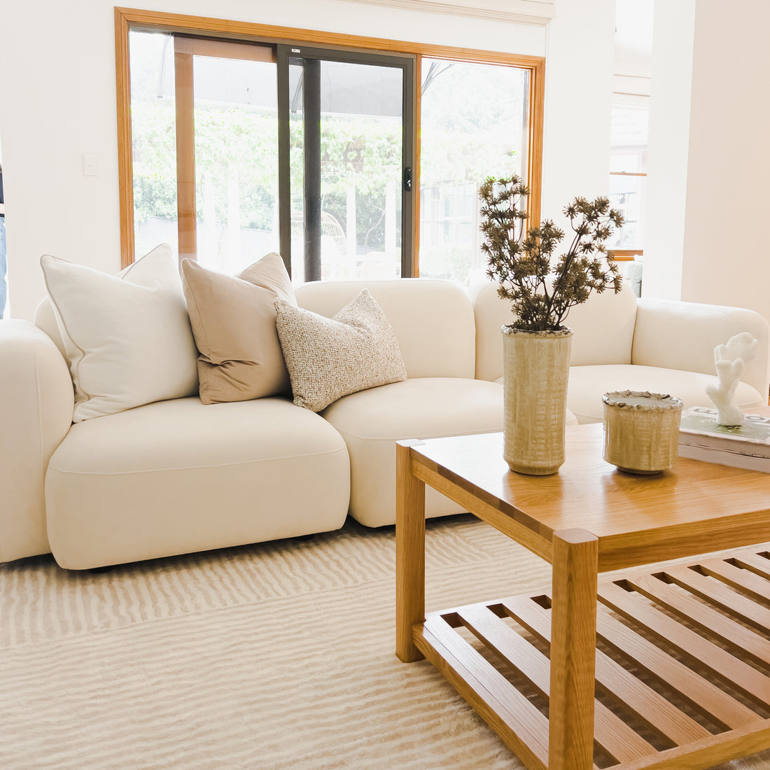 Close-up of a white pillow on the Soraya 3 Seater Modular Velvet Sofa Set, showcasing the plush velvet upholstery and modern design of this cream white sofa set.