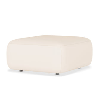 Soraya Velvet Fabric Ottoman in Cream White, featuring a low, square design with softly rounded edges, upholstered in pale cream fabric, and supported by four small dark feet against a plain background.