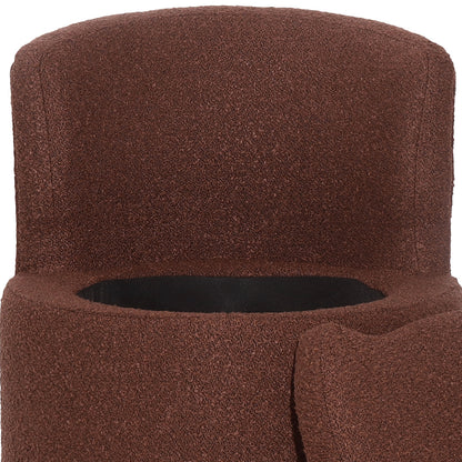 Close-up of the Sorra Boucle Swivel Storage Accent Chair showing its cylindrical shape, loop-pile fabric, and circular entrance, suggesting a hidden storage feature within the chair's design.