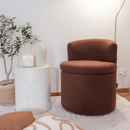 Sorra Boucle Swivel Storage Accent Chair in Rust Brown, featuring soft bouclé fabric, a low curved back, and hidden storage beneath the removable seat. Set in a cozy reading nook with a mosaic table.