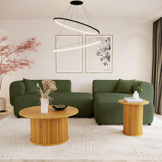 The Susie 4-Seater Boucle L-Shaped Sofa features a plush, dark green design with an ergonomic curved backrest, enhancing any living room with its modern and spacious seating arrangement.