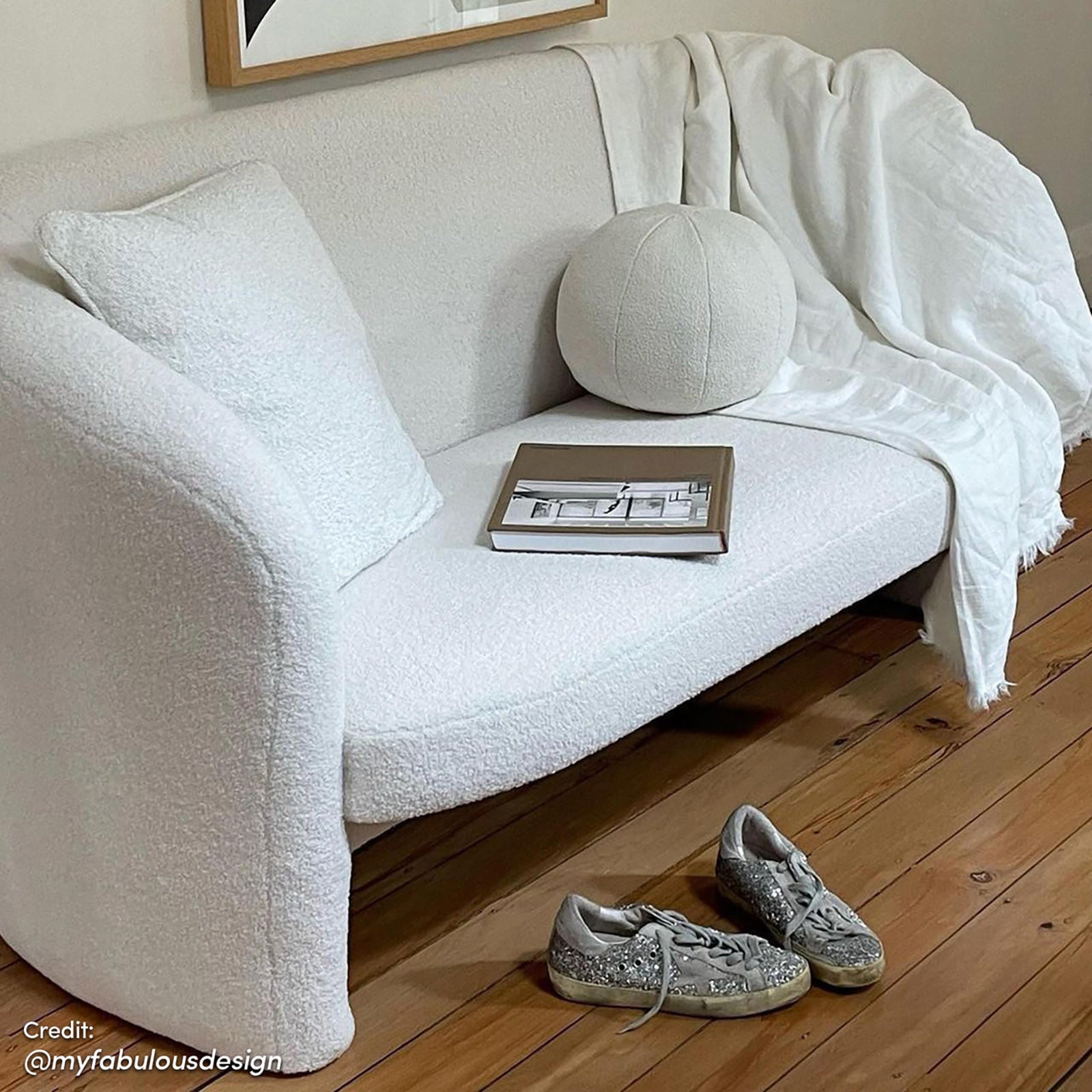 Tasha Boucle 2 Seater Sofa Cream White with boucle upholstery, curved arms, and solid wood frame, displayed in a living room setting.