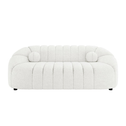 Trina 5 Seater Boucle Sofa Set with Pillows in Cream White features a modern, rounded design with channel-stitched cushions and two round bolster pillows, offering plush, stylish seating.