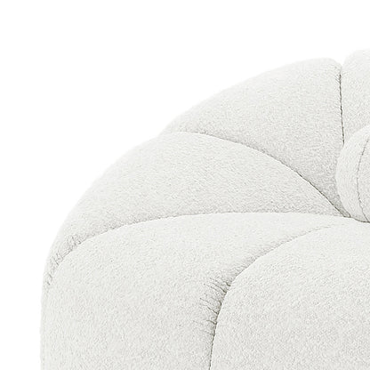 Close-up of the tufted corner of the Trina 5 Seater Boucle Sofa Set with Pillows in Cream White, showcasing its soft boucle fabric and meticulous stitching for a luxurious finish.