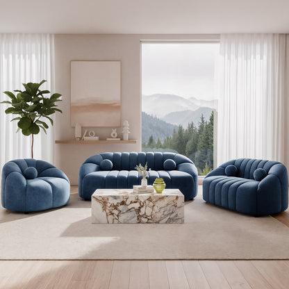 Trina 6-Seater Tufted Velvet Lounge Set in Blue featuring plush channel-tufted seating, a sculptural design, and a serene living room setting with a marble coffee table and scenic mountain view.