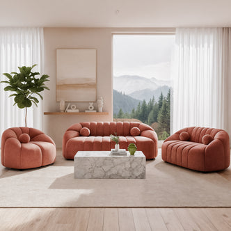 Trina 6 Seater Tufted Velvet Lounge Set in Blush features a plush sofa, loveseat, and armchair with channel tufting, elegantly arranged in a minimalist living room with a marble-patterned coffee table.