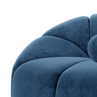 Trina Single Velvet Tufted Accent Chair in Blue, showcasing deep blue velvety upholstery with scalloped channel tufting, shell-like design, and a matching decorative ball cushion for a stylish, modern look.