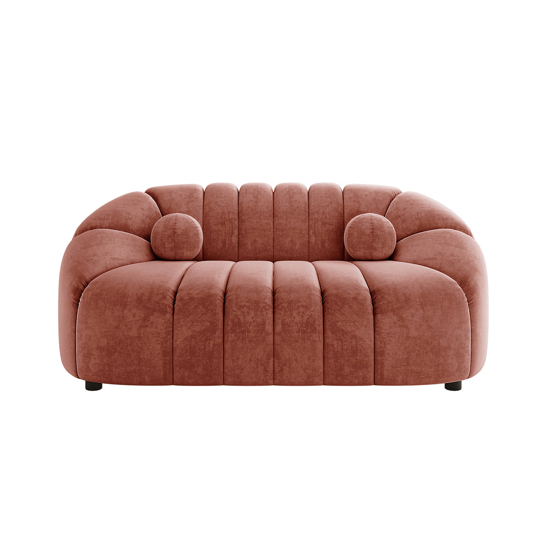 The Trina 2 Seater Tufted Curved Velvet Sofa in Blush showcases a sculptural, modern design with chunky channel-tufted padding and matching bolster pillows, ideal for compact, stylish living spaces.