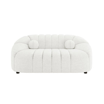 Trina 2 Seater Boucle Sofa with Pillows in Cream White features an off-white textured fabric, softly rounded low-slung form, vertical channel tufting, pill-shaped silhouette, and includes two matching bolster pillows.