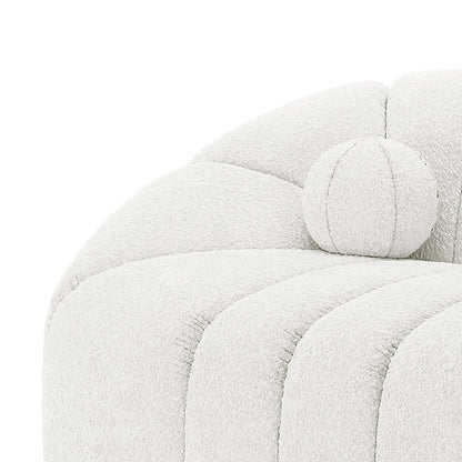 Trina 2 Seater Boucle Sofa with Pillows in Cream White features a modern scalloped channel-tufted design, plush off-white upholstery, and includes a matching round bolster pillow for added style and comfort.