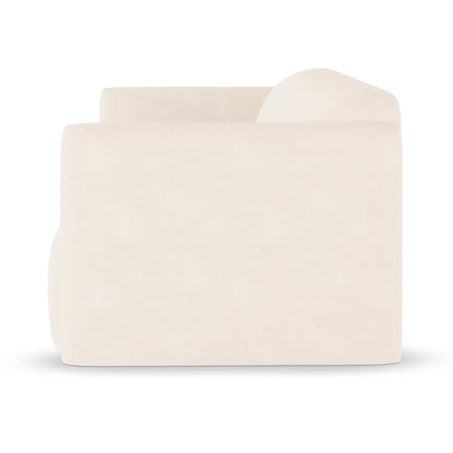 Vestalia 3 Seater Velvet Sofa in Cream White, featuring a blocky, low-slung design with thick seat and raised back cushions, upholstered in smooth fabric, shown in profile against a white background.