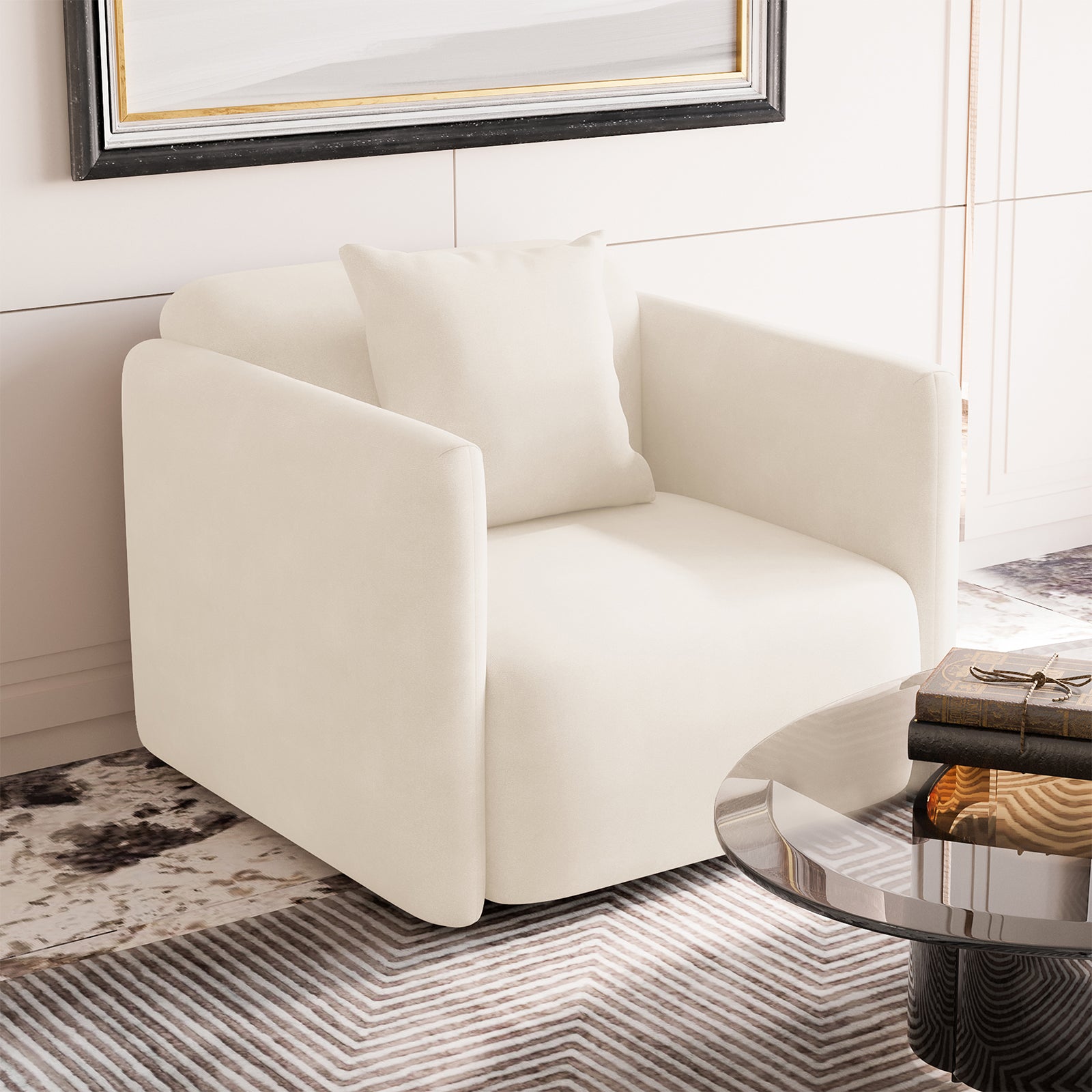 Vestalia Single Seater Velvet Sofa in Cream White, featuring a sleek, boxy design with plush upholstery. Paired with a matching cushion, it sits on a patterned rug, exuding elegance in a minimalist setting.