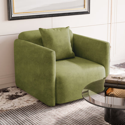 Vestalia Single Seater Velvet Sofa in Olive Green, cube-shaped with clean lines; includes a matching green throw pillow, placed on a patterned area rug beside a glass-topped coffee table.