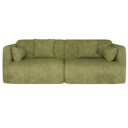 Vestalia 4 Seater Velvet Sofa Set in Olive Green features two adjoining modules with rounded corners, soft suede-like fabric, and four matching throw pillows, embodying modern luxury and comfort.