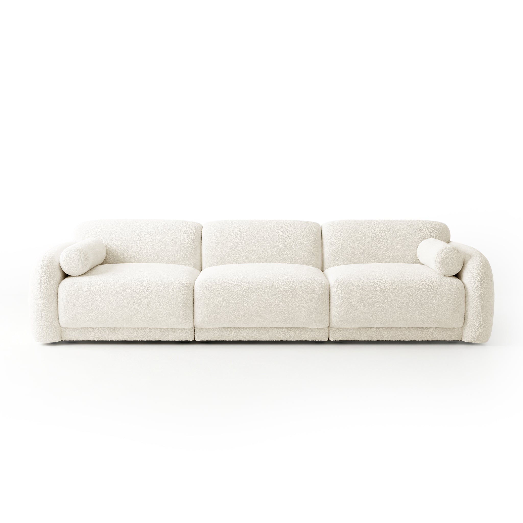 Modern three-seater sofa in off-white with two cylindrical bolster pillows on white background