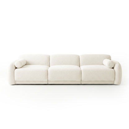 Modern three-seater sofa in off-white with two cylindrical bolster pillows on white background