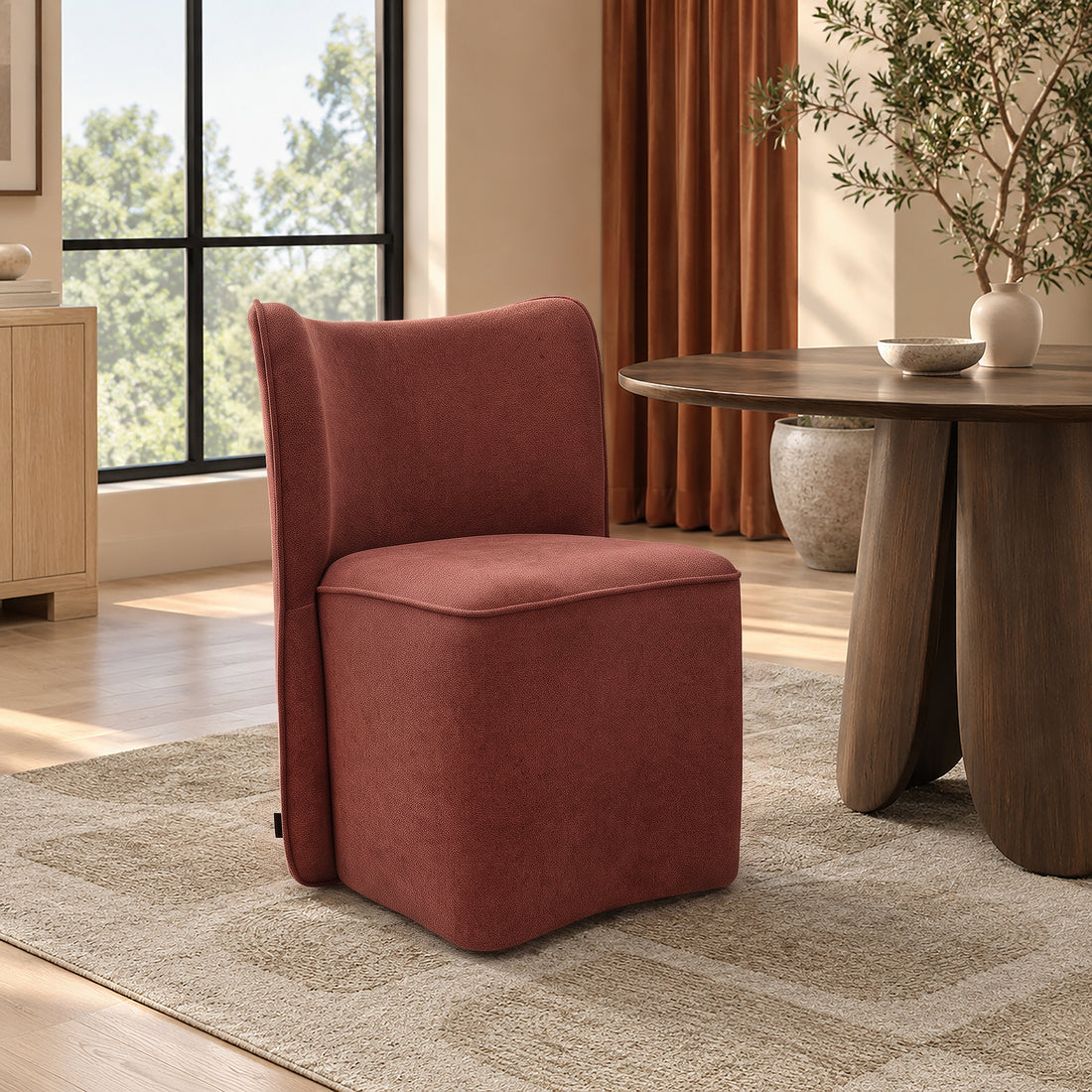 Rust-colored upholstered chair in a warm room setting