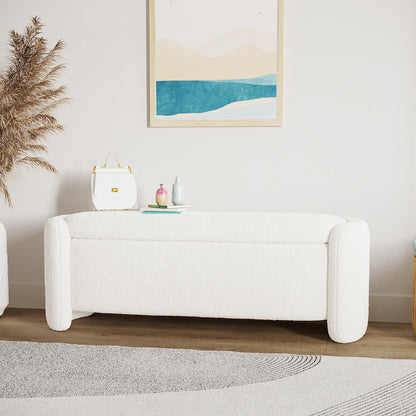 Wynne Fabric Storage Ottoman Bench Seat in Cream White, upholstered in soft boucle, with a small white handbag, decorative vases, and a book on top, set in a minimalist interior.