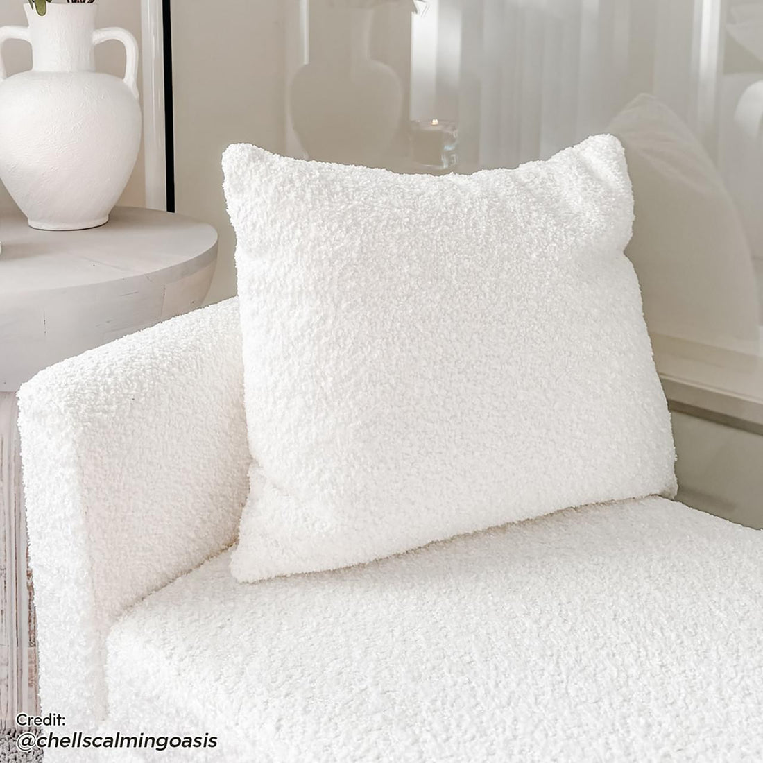 Zamira Large Boucle Storage Ottoman Bench in Cream White, featuring soft boucle upholstery, visible hidden storage, and a sleek, minimalist design, complements the modern seating corner with its elegant functionality.