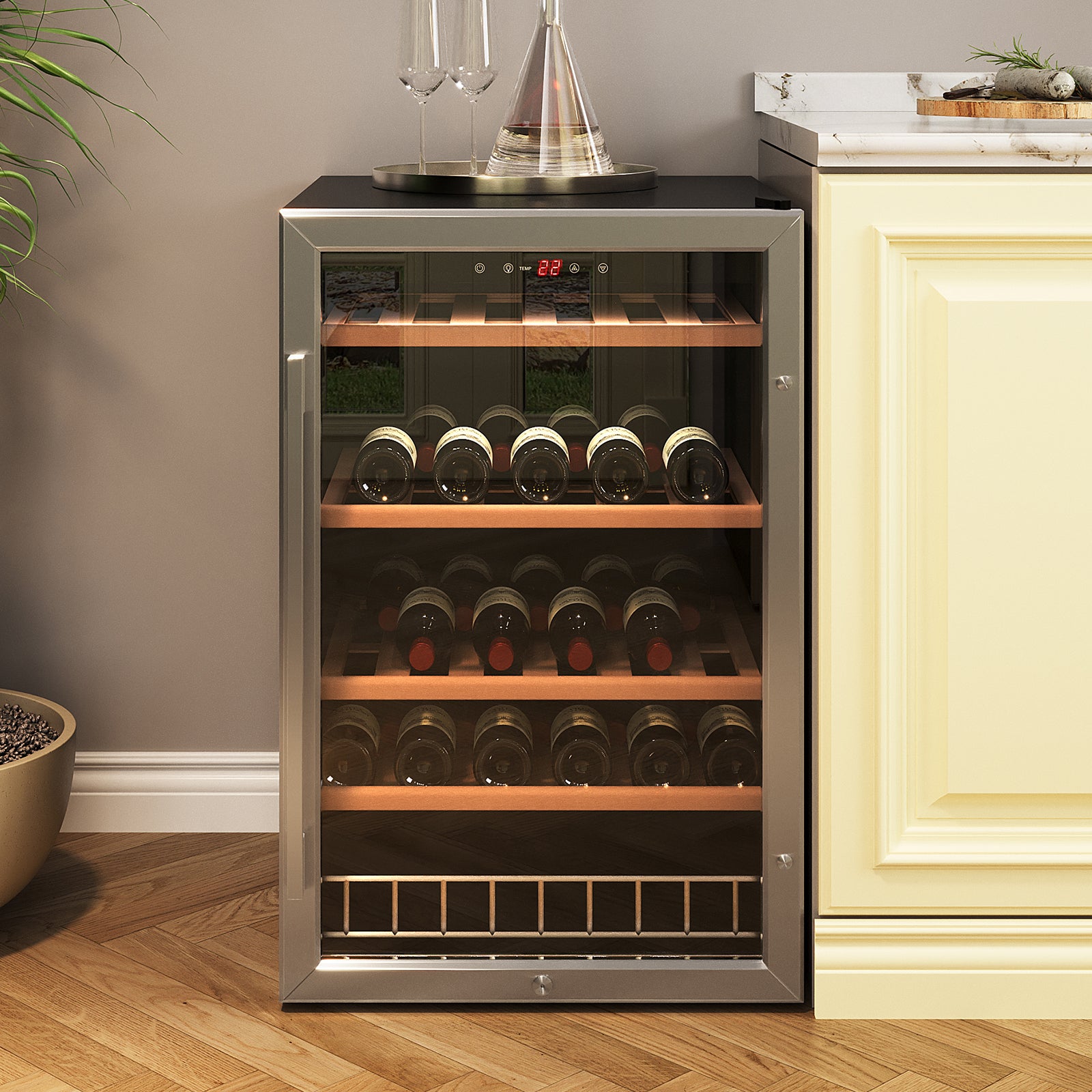 C130 45 Bottle Under Bench Wine Fridge in Black with glass-front door, digital display at 22°C, showcasing four wooden shelves of wine bottles, topped with tray holding glasses and decanter.
