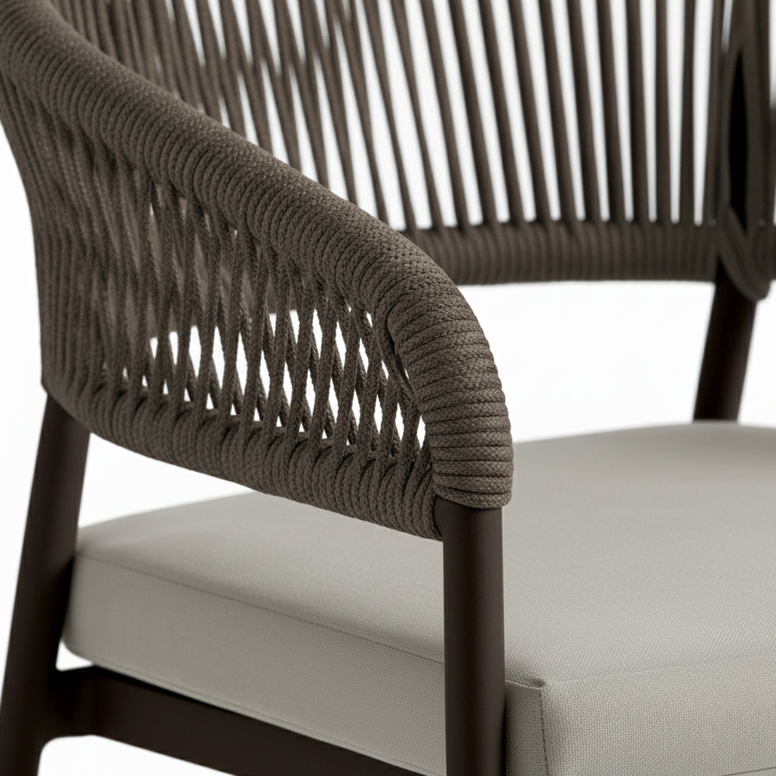 Close-up of Coastal Outdoor Rope Dining Chairs Set of 2 in Brown, showcasing the sleek tubular frame wrapped in dark woven rope and light upholstered seat cushion, highlighting modern coastal design and comfort.