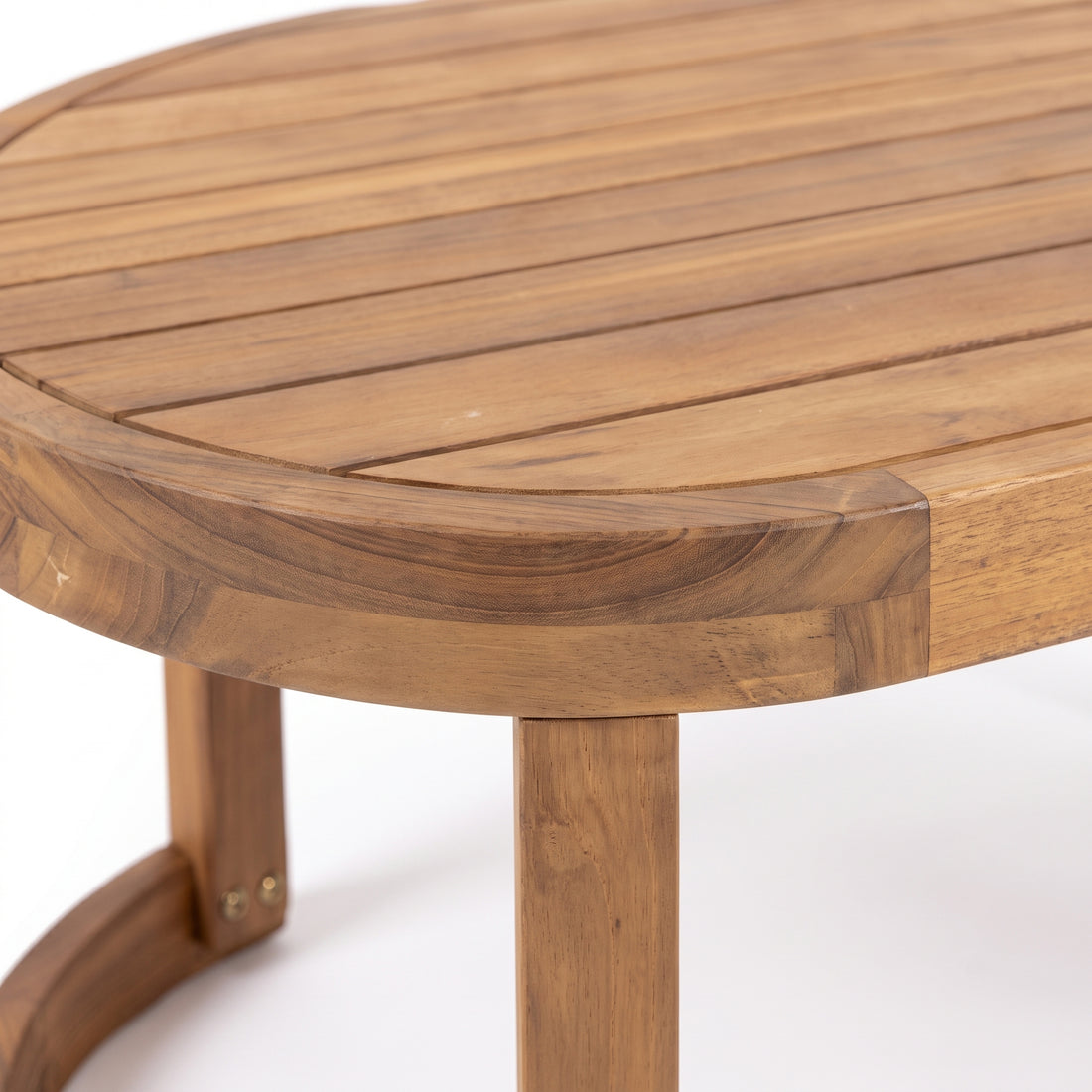 Close-up of a wooden table corner showing wood grain and joinery on a white background