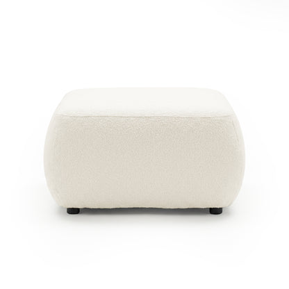 Cream upholstered ottoman on white background