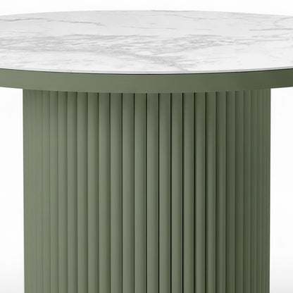 Evone Aluminium Outdoor Dining Table in Green, featuring a round, fluted, cylindrical base with a white, marble-look tabletop showcasing subtle gray veining, designed for outdoor durability and style.