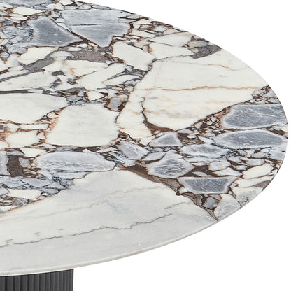Gracie 120cm Round Marble Dining Table features a white, gray, and brown veined marble top with a visible ribbed, dark pedestal base, offering a luxurious and elegant dining centerpiece.