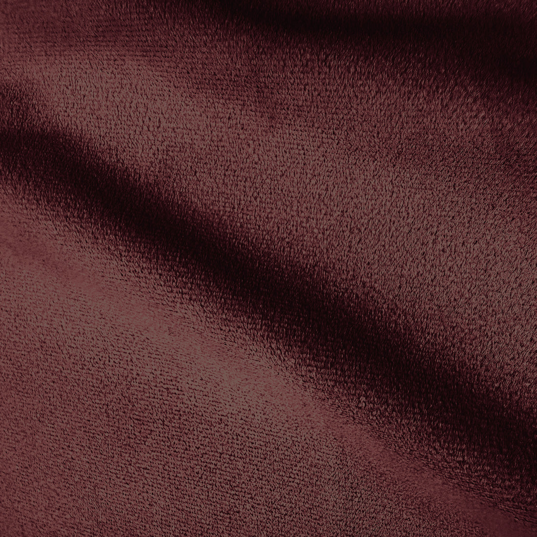 Extreme close-up of burgundy upholstery fabric texture