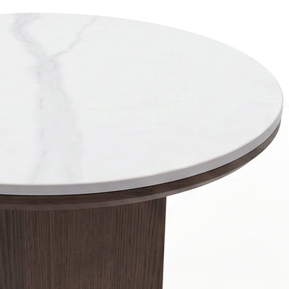 Close-up partial view of a round table with marble top and dark wood base on white background