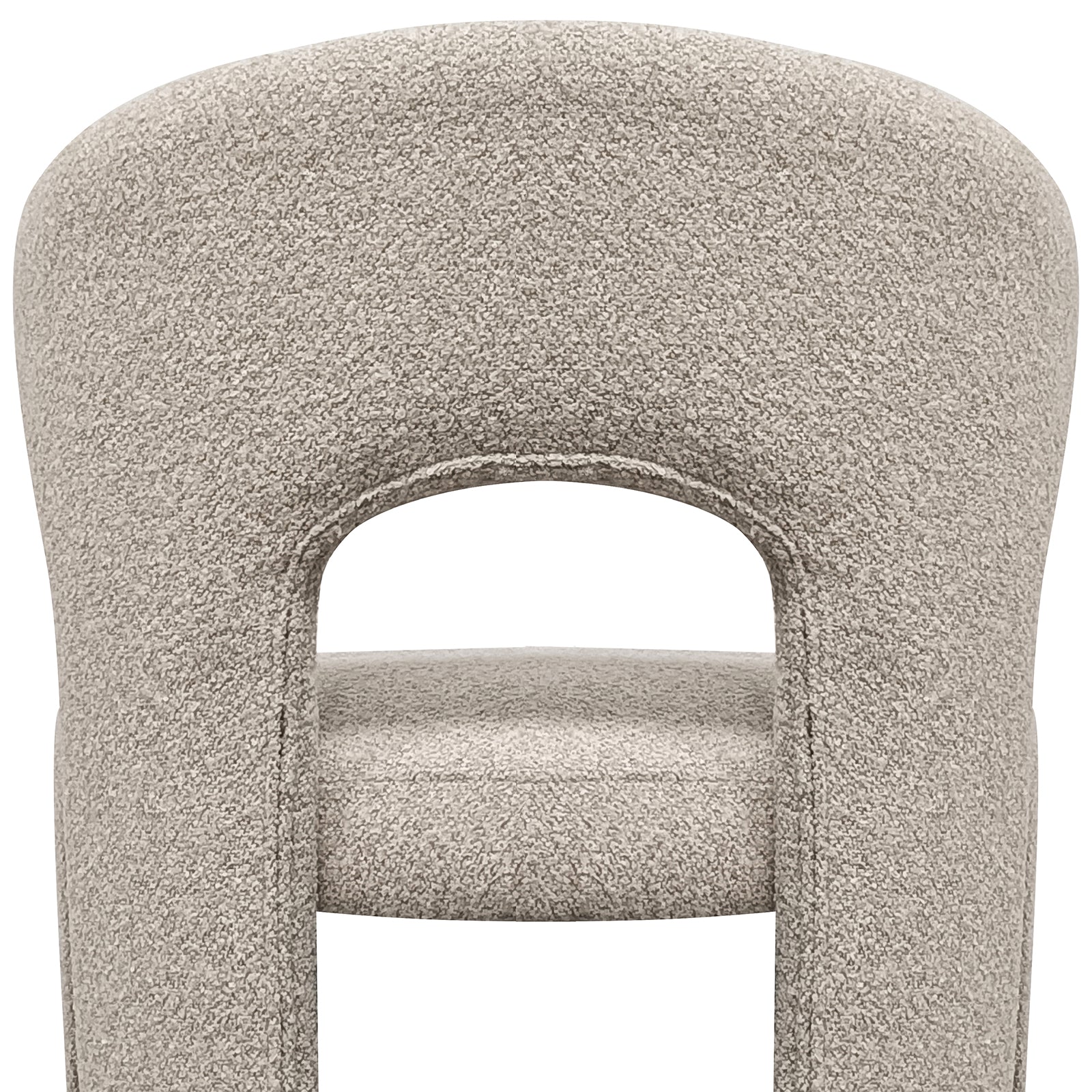 Lunari Bouclé Curved Accent Chair in Beige features a plush, sculpted backrest with a keyhole cutout, padded legs, and a minimalist design, offering comfort and style for modern spaces.