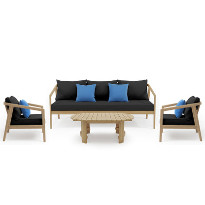 Delva 4 Seater Hardwood Acacia Outdoor Sofa Set in Black features a three-seat sofa, two matching armchairs with blue throw pillows, and a slatted wood coffee table, creating a modern lounge arrangement.