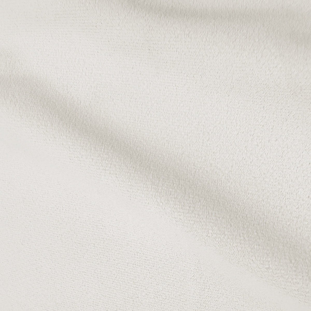 Close-up of softly textured cream upholstery fabric