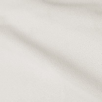 Close-up of softly textured cream upholstery fabric