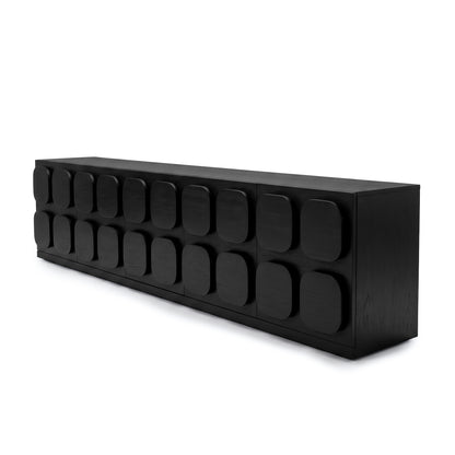 Long black sideboard with geometric front panels on a white background