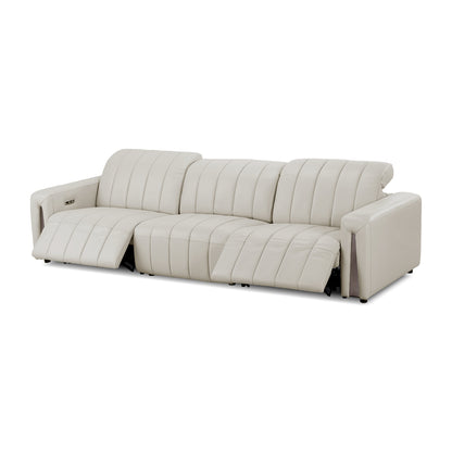 Light beige sectional sofa with extended footrest on a white background.