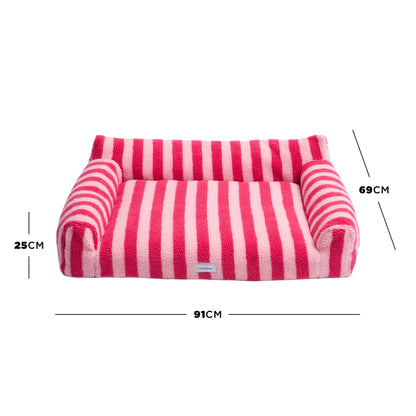 Pink striped pet bed on white background with arrows and labels showing height 25 cm, width 91 cm, depth 69 cm