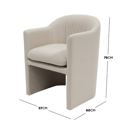 Liora Bouclé Curved Accent Armchair in Beige features a curved backrest and armrests upholstered in textured bouclé, with a loose seat cushion. Its compact design fits effortlessly into small spaces.