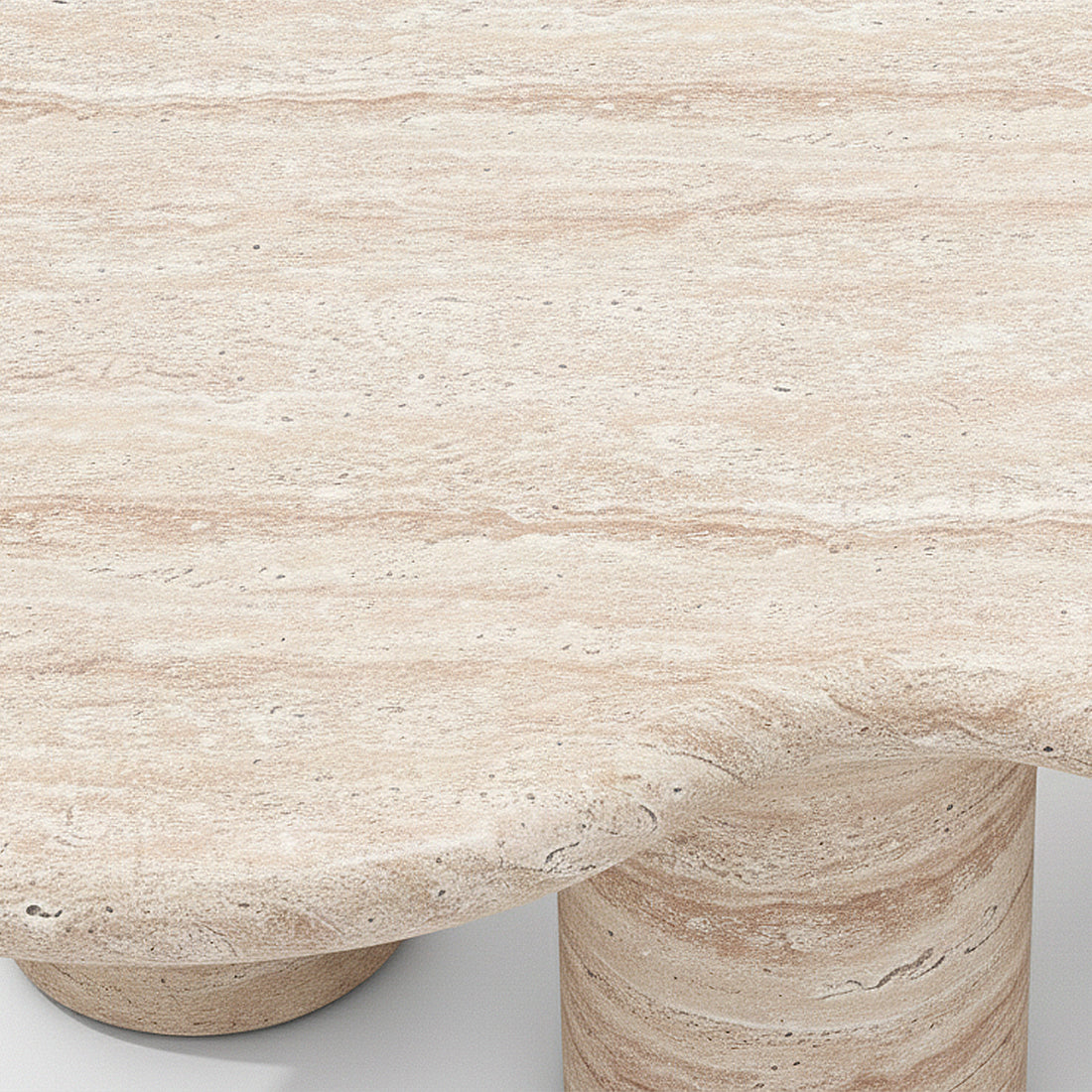 Close-up of coffee table corner and cylindrical leg showing stone texture