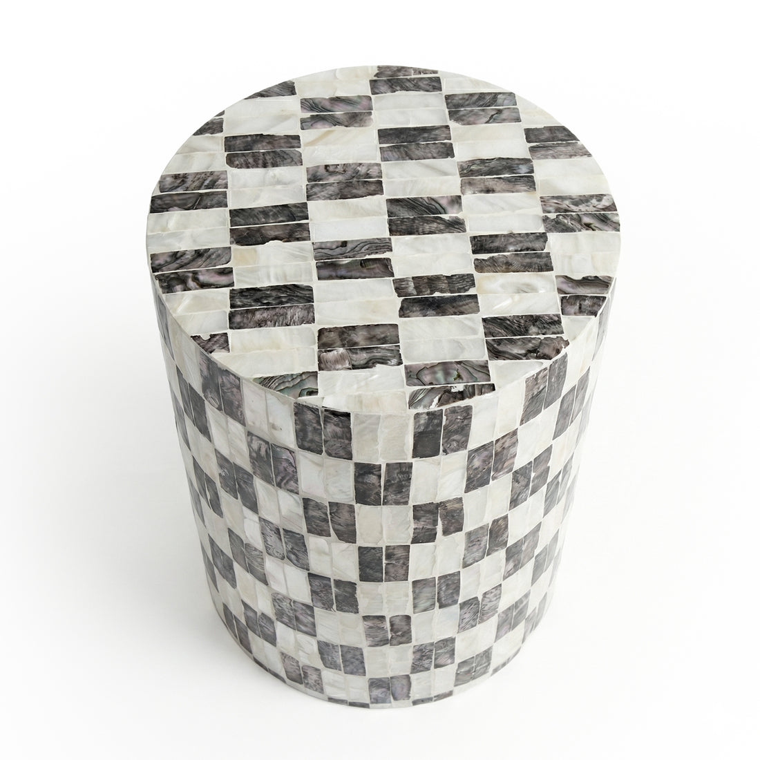 Black and white checkered cylindrical side table on white background