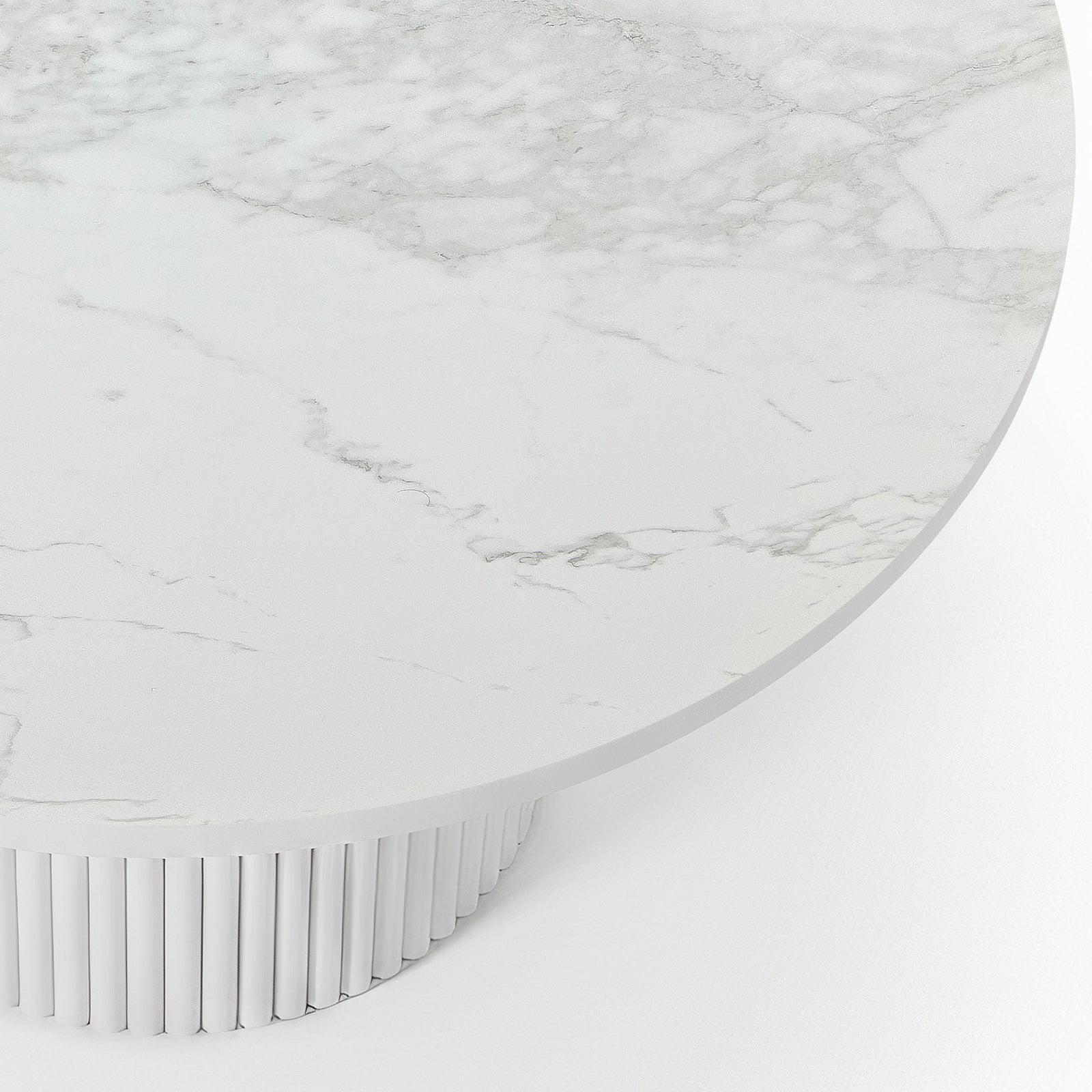 Evone Aluminium Outdoor Dining Table in White featuring a round marble-look surface with subtle gray veining, atop a cylindrical, vertically fluted base, embodying a modern, minimalist design.
