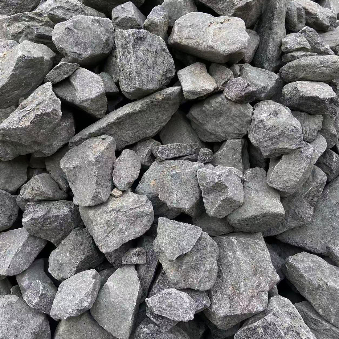 Close-up of rough grey stones showing texture and variation